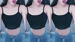 this chinese girl is dancing and shaking her ass so sexily