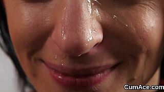 Unusual centerfold swallows sperm in blowbang bukkake.