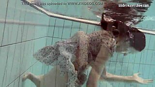 Loris Licicia swims naked underwater in pool.