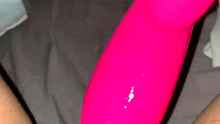A young woman with tattoos has strong orgasm while she pleases herself