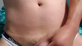 This gay boy is masturbating in his underwear, feeling so excited about it.