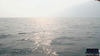 Exotic Playboy model strips naked on a boat outdoors. Her hairy charm shines.