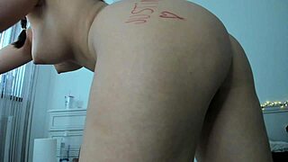 Big beautiful woman writes the name of her admirer on her body