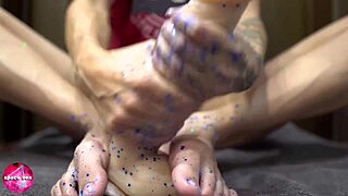 Babe Delivers Sensual Footjob on Rubber Cock
