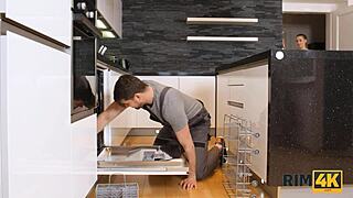 Handyman gets his ass intensely worshipped by sexy client in kitchen.