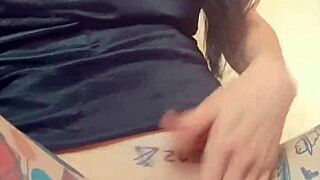 Goth woman with huge pussy lips shows off and masturbates her big pussy.