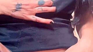 Goth woman with huge pussy lips shows off and masturbates her big pussy.