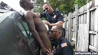 Two police officers in uniform take advantage of a black guy in the office for a hardcore interracial threesome