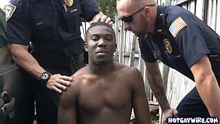 Two police officers in uniform take advantage of a black guy in the office for a hardcore interracial threesome