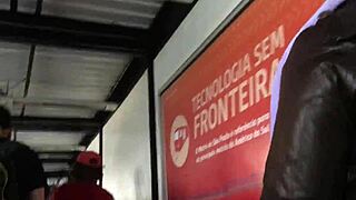 Touching the chubby girl's brown nylon jacket on the street, feeling the puffy material.