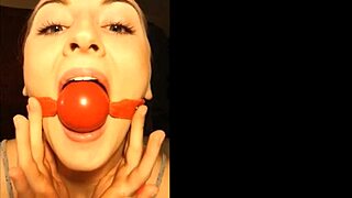 Bound blonde slut choked and gagged in secret bdsm tape.