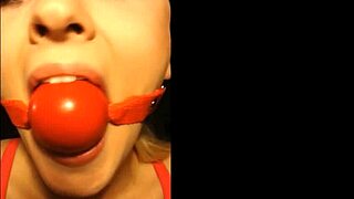 Bound blonde slut choked and gagged in secret bdsm tape.