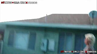 Blackwidow xxx lounges by pool, big tits on display.