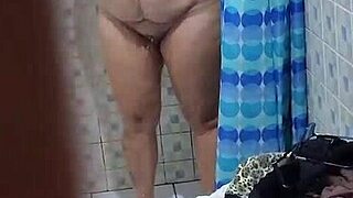 hey, check out this curvy milf neighbor showering secretly, her big ass on display