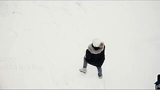 Couple enjoys intimate moment after snowy playtime