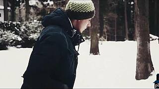 Couple enjoys intimate moment after snowy playtime