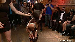 Public display of bondage and hardcore lesbian sex with a brunette babe