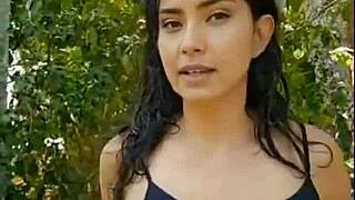 Skinny Latina brunette teases with wet body in forest