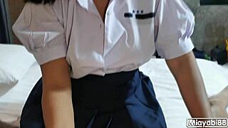 Thai student sucks and rides until cum spills on shiny skirt
