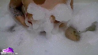 Cute Babe Sloppy Sucking Huge Dildo Sitting In Bath With Foam