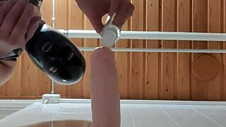 latexi69 rides big dildo in latex