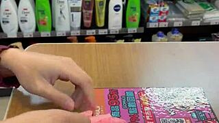 Beautiful Asian Ladyboy Seductively Shows Off Her New Stockings and Thong in the Bustling Convenience Store