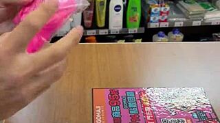 Beautiful Asian Ladyboy Seductively Shows Off Her New Stockings and Thong in the Bustling Convenience Store