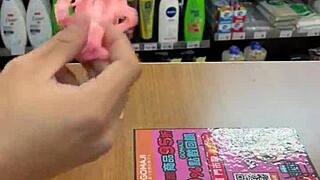 Beautiful Asian Ladyboy Seductively Shows Off Her New Stockings and Thong in the Bustling Convenience Store