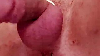 Gay man sits hard on the big black cock for bareback riding.