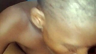 Close up of an amateur black teen giving a blowjob