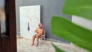 spying on busty african neighbor showering naked in backyard