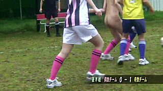 Young Asian girls playing football in the nude outdoors