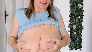 Busty braless gilf MariaOlds strips and dances with sporty groove. Her big tits steal the show!