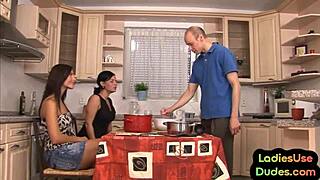 CFNM threesome with teen dominas and strapon action on kitchen table