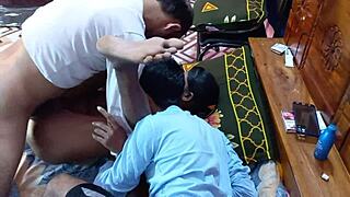 Asian girl gets pumzied by two hard cock wielding men