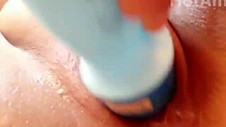 Close up of a hot Latina inserting a deodorant into her pussy