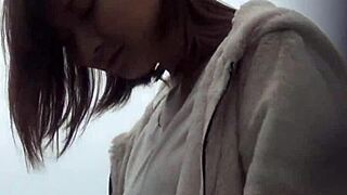 Beautiful Asian girl gives a sensual massage to herself