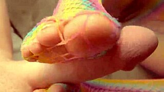 sexy babe gives footjob while playing with her wet pussy