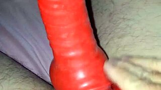 Husband Models Latex Suit With Rubber Sheath For Amateur Costume.