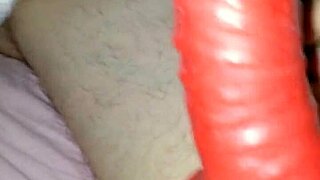 Husband Models Latex Suit With Rubber Sheath For Amateur Costume.