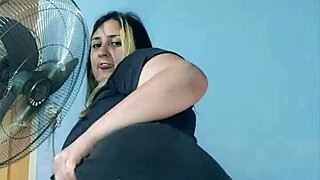 bbw yoga instructor stretches in tight shorts