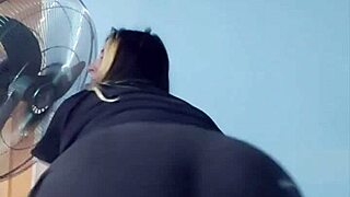 bbw yoga instructor stretches in tight shorts