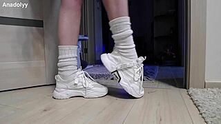 Delicate legs in sneakers are waiting for you