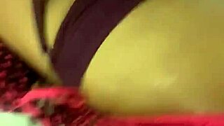 spanish woman and african man share an intimate interracial moment. with bent over poses and wet touches.