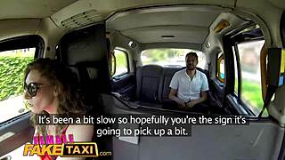 Female fake taxi driver in red dress drives passenger in backseat