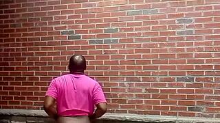 A private dancer performs striptease facing backwards in warm weather