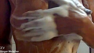 ginger gets soapy with wet nipples and tits closeup