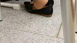 she teases with shoeplay, dipping tan nylons and flats in a fetish scene