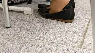 she teases with shoeplay, dipping tan nylons and flats in a fetish scene