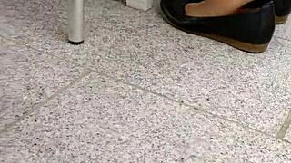 she teases with shoeplay, dipping tan nylons and flats in a fetish scene